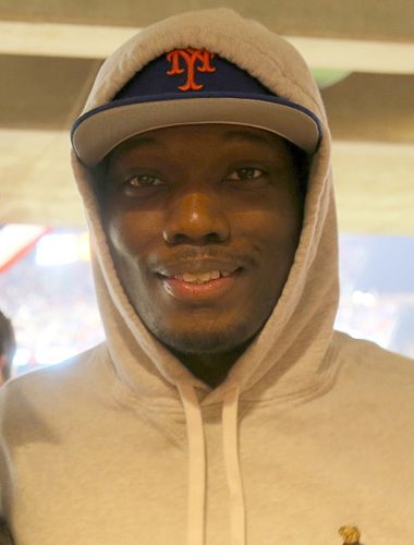 Portrait picture of Michael Che